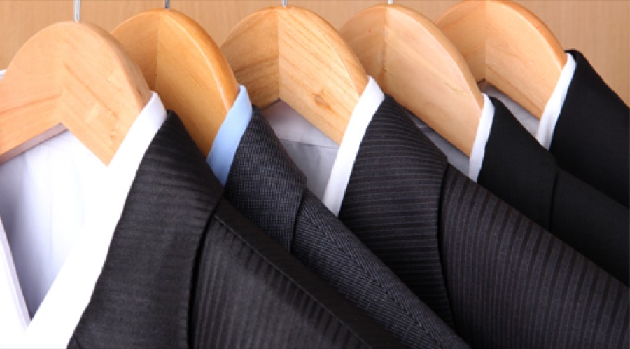 Pressed suits hanging in a row